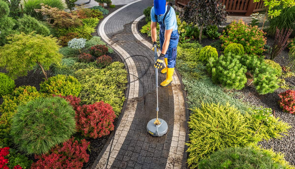 Professional washing of backyard garden pathways by Lee's General Landscaping