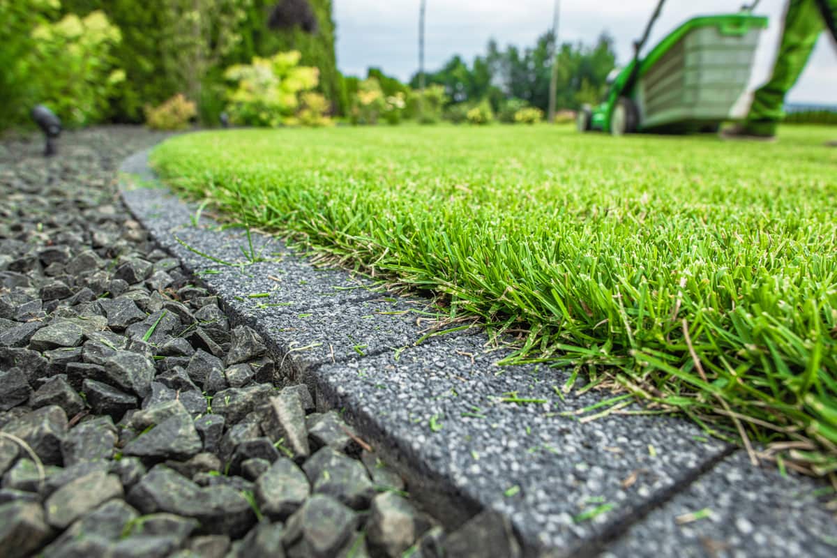 Clean trimmed lawn with cobble edging