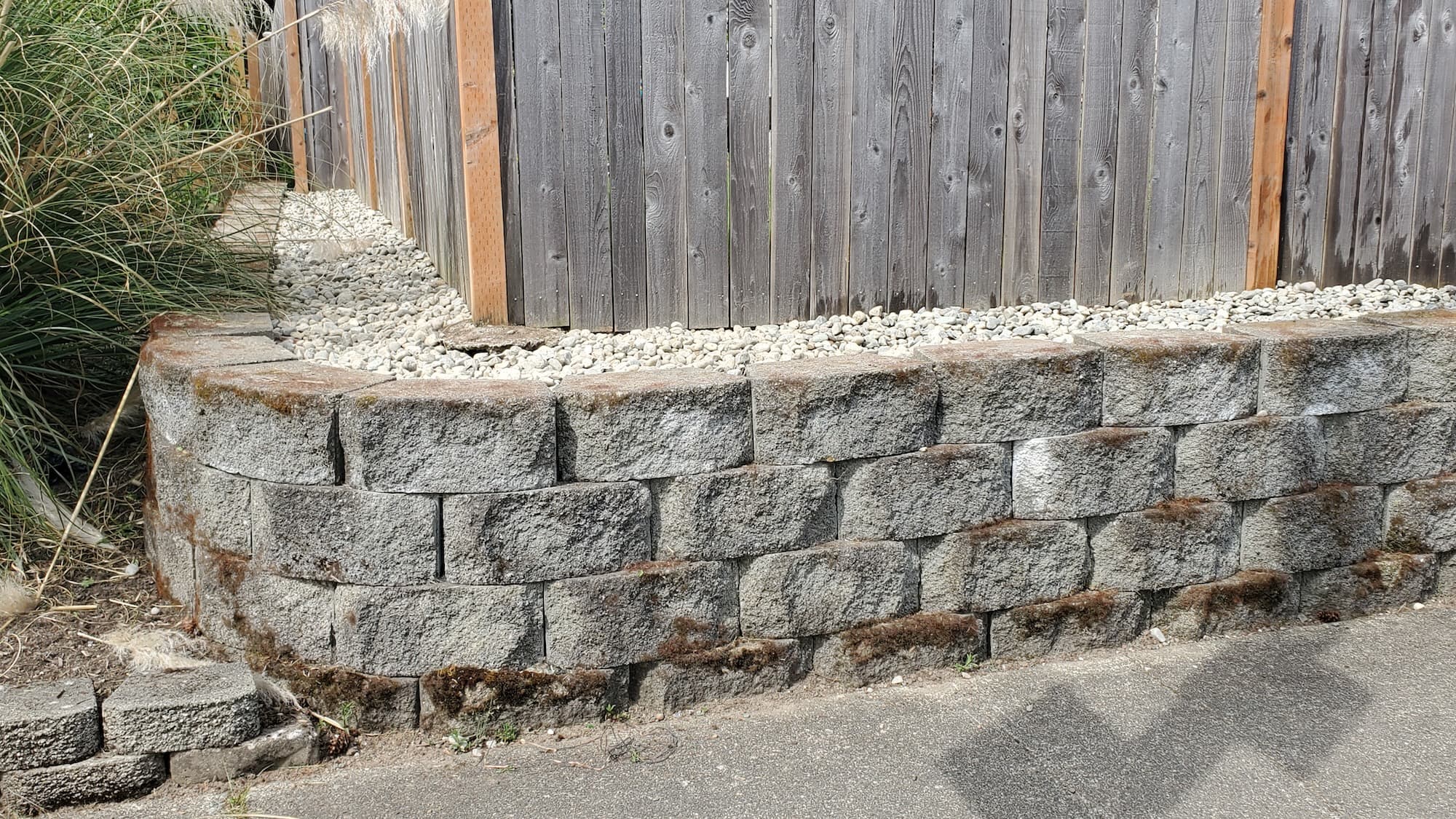 Lee's General Landscaping workers constructing a retaining wall